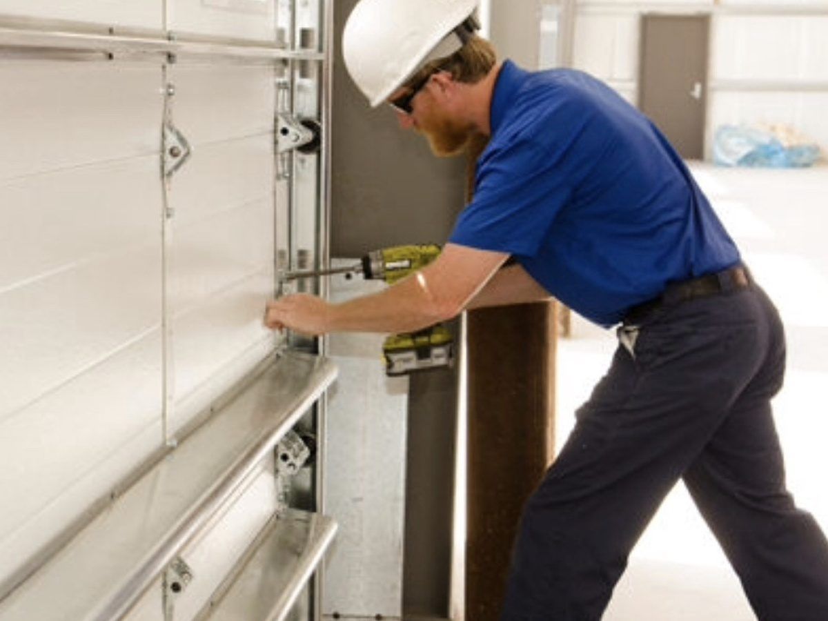 Garage door repair service by professional technician