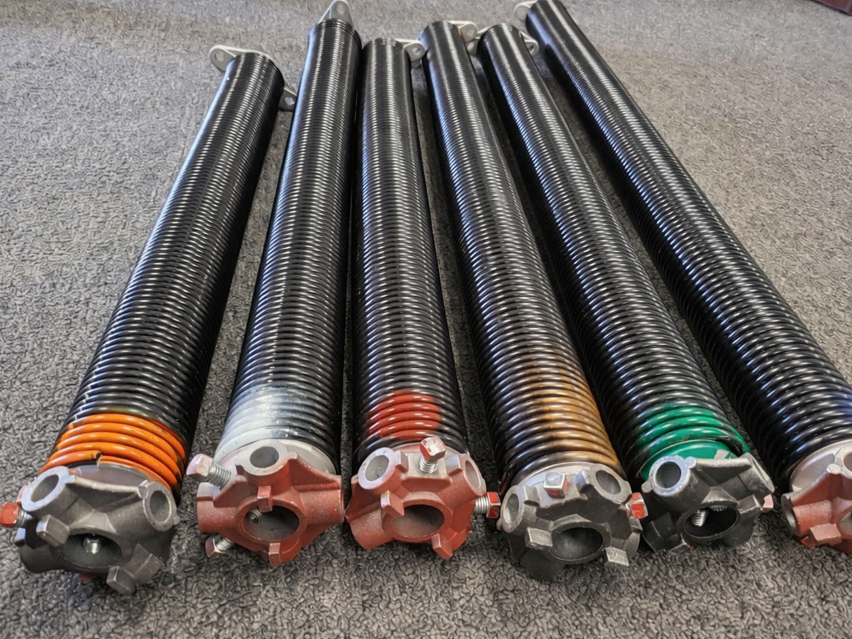 Garage door torsion springs in different sizes used for proper door balance