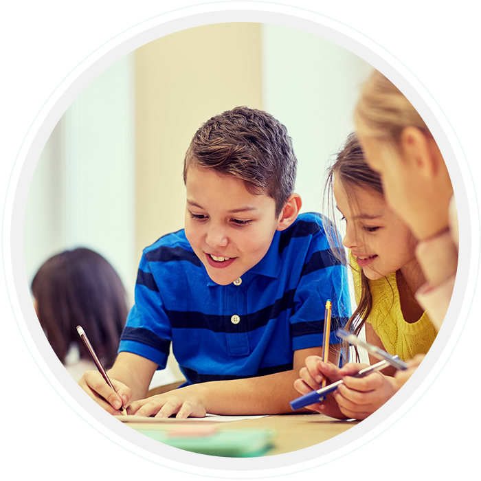 three children engaged in a writing activity