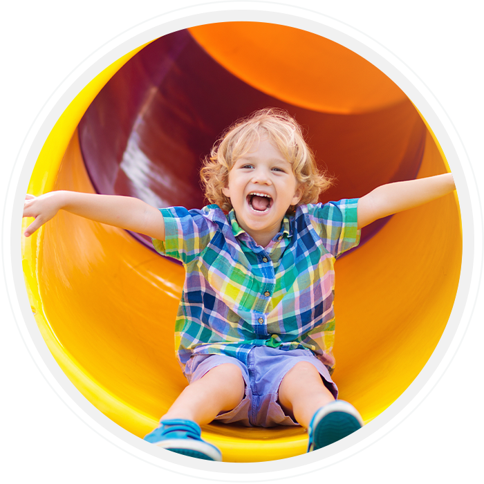a child at the end of a slide