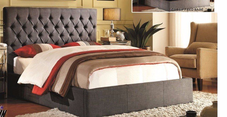 upholstered bed with a tufted headboard and a gas lift bed base