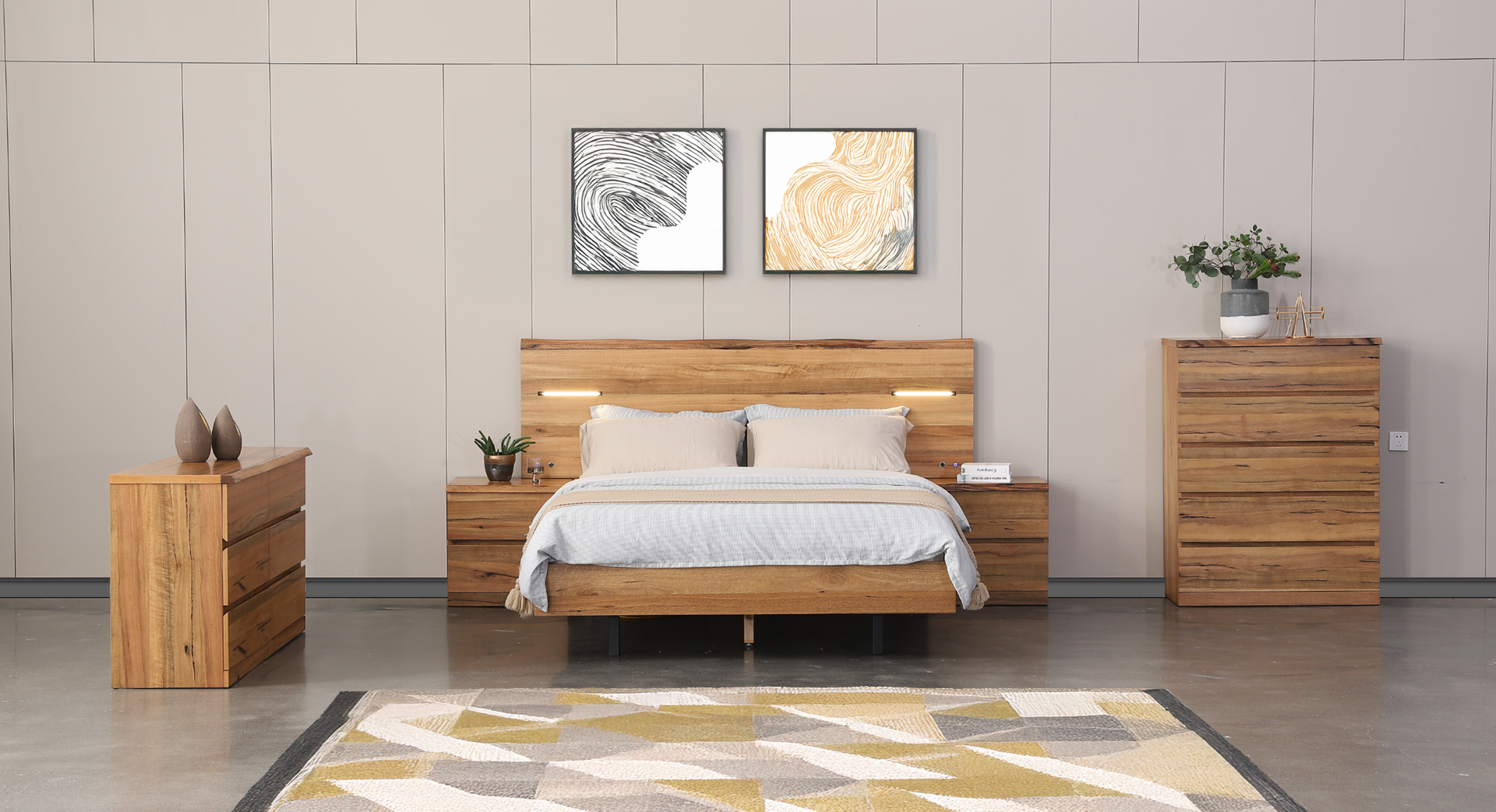 Classic bedroom suite with a bed, dresser, nightstand and mirror.