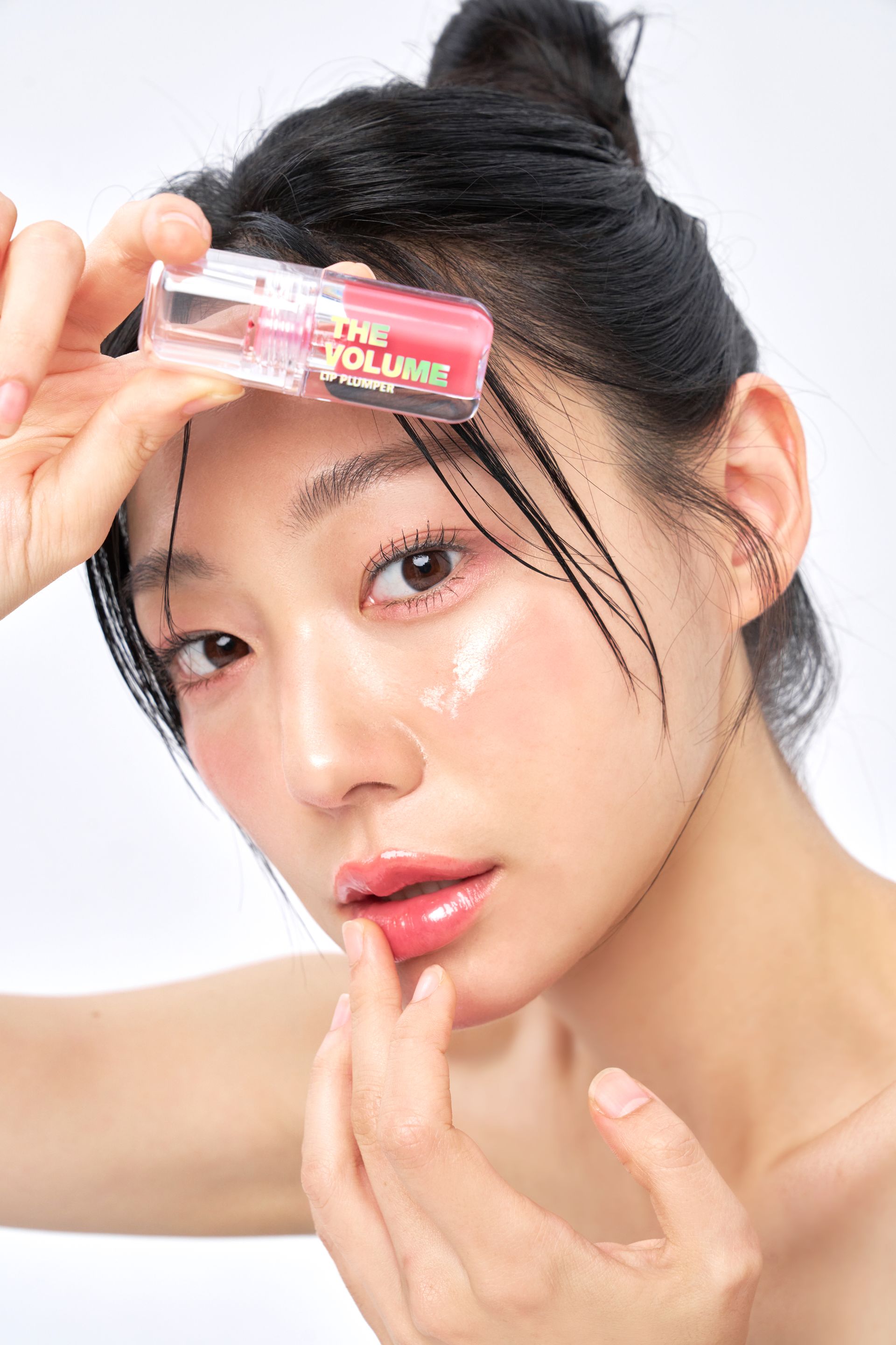 Two ElishaCoy lip plumpers with text, 