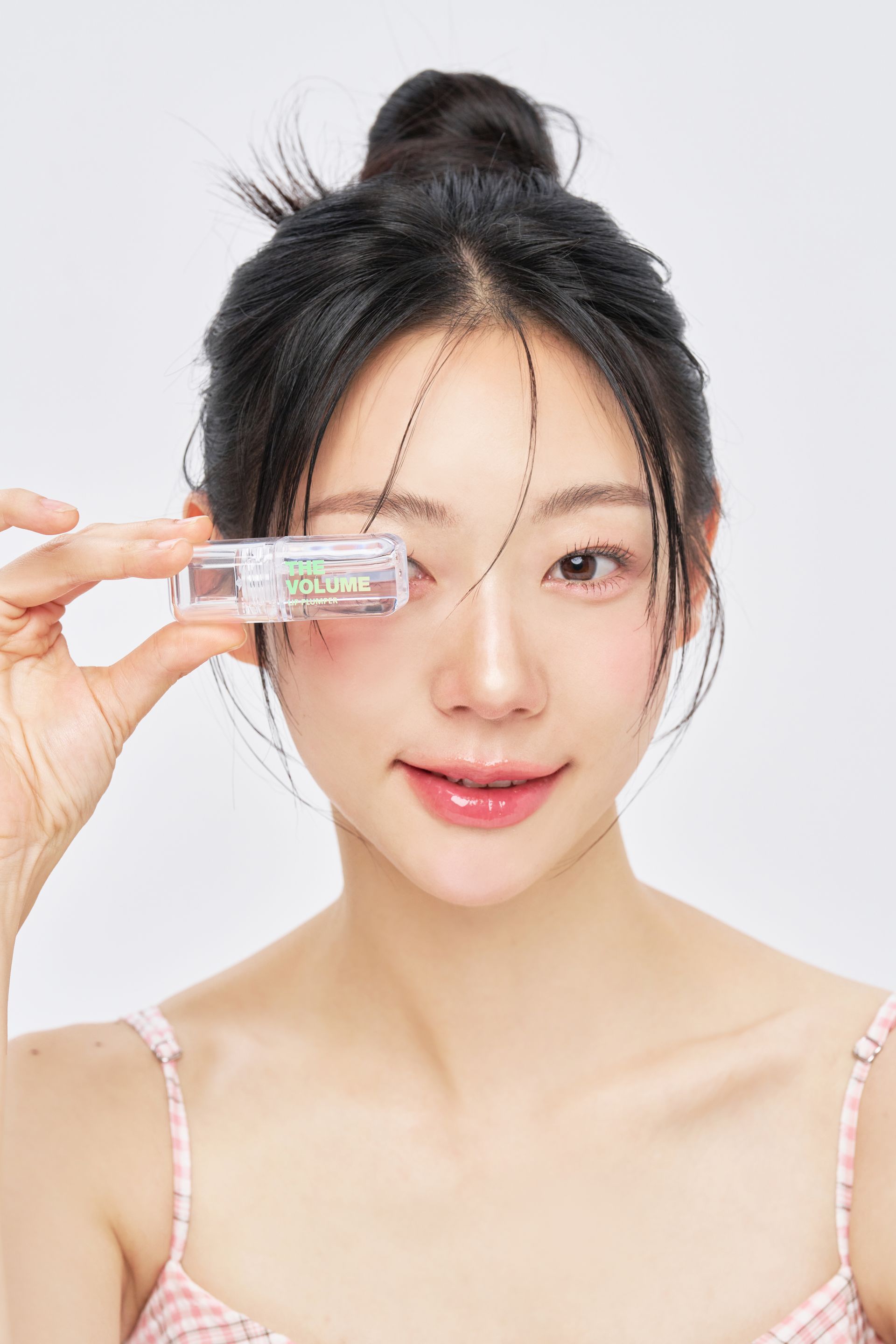 Two ElishaCoy lip plumpers with text, 