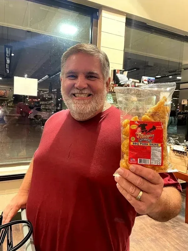 J-Boogie’s Tasty Creations customers showing appreciation and holding BBQ products during a special event.