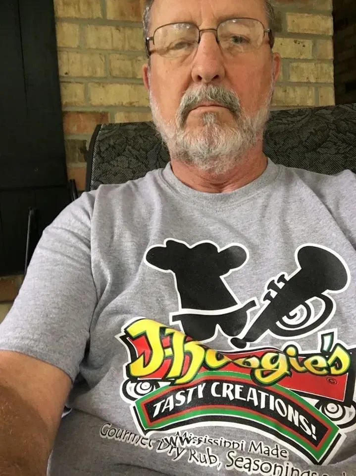 J-Boogie’s Tasty Creations customers showing appreciation and holding BBQ products during a special event.