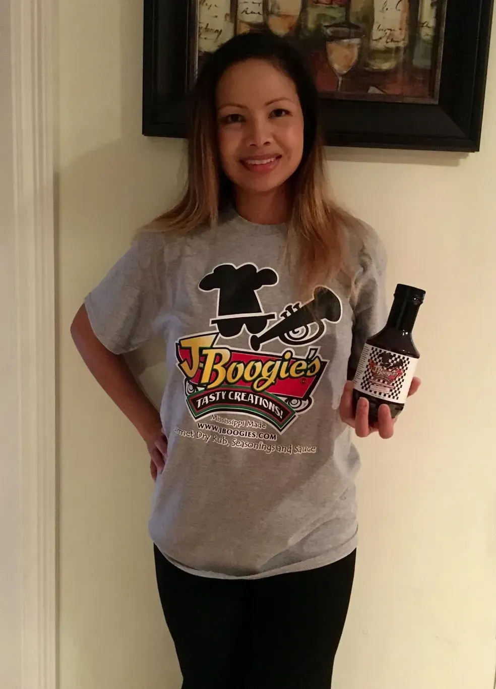 J-Boogie’s Tasty Creations customers showing appreciation and holding BBQ products during a special event.