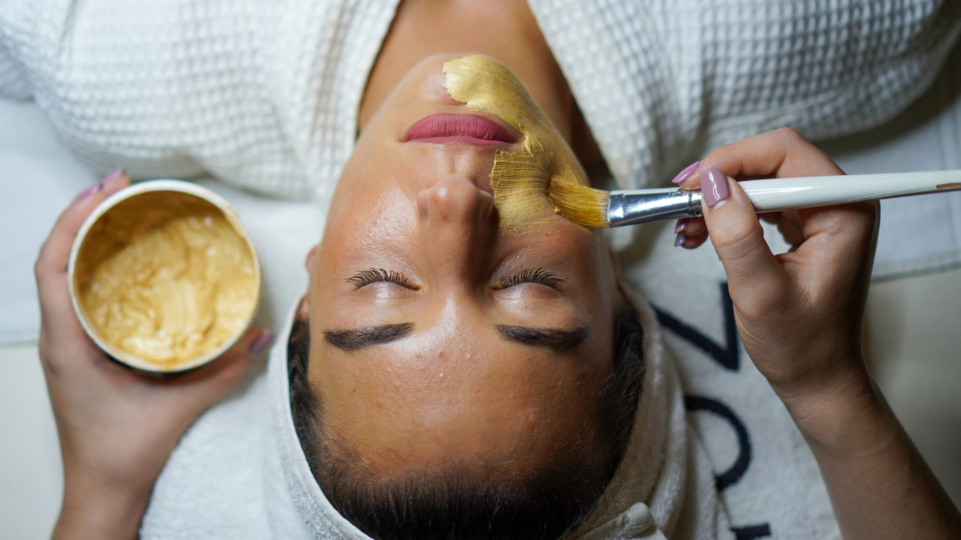 Woman laying down on a table for a facial