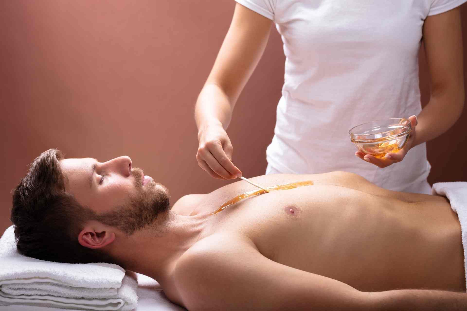 A customer receiving body waxing for men near Lexington, Kentucky (KY) 