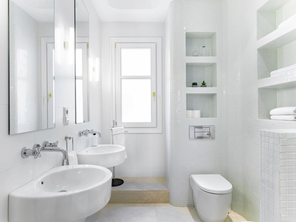 A Bathroom with Two Sinks, a Toilet and A Window — All Trade Renovations- Peter Whelan in Wyoming, NSW