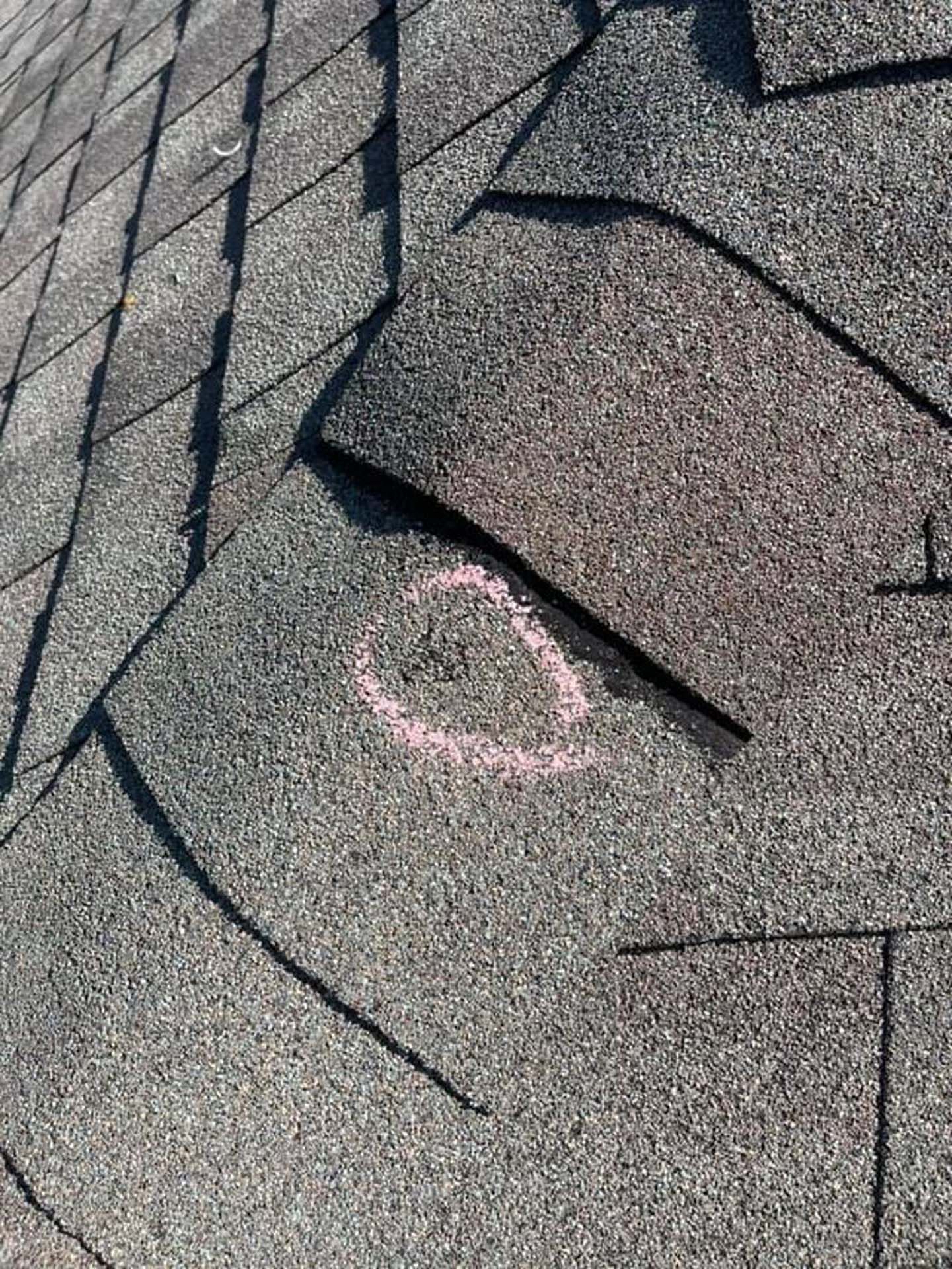 A close up of a roof with a hole in it.