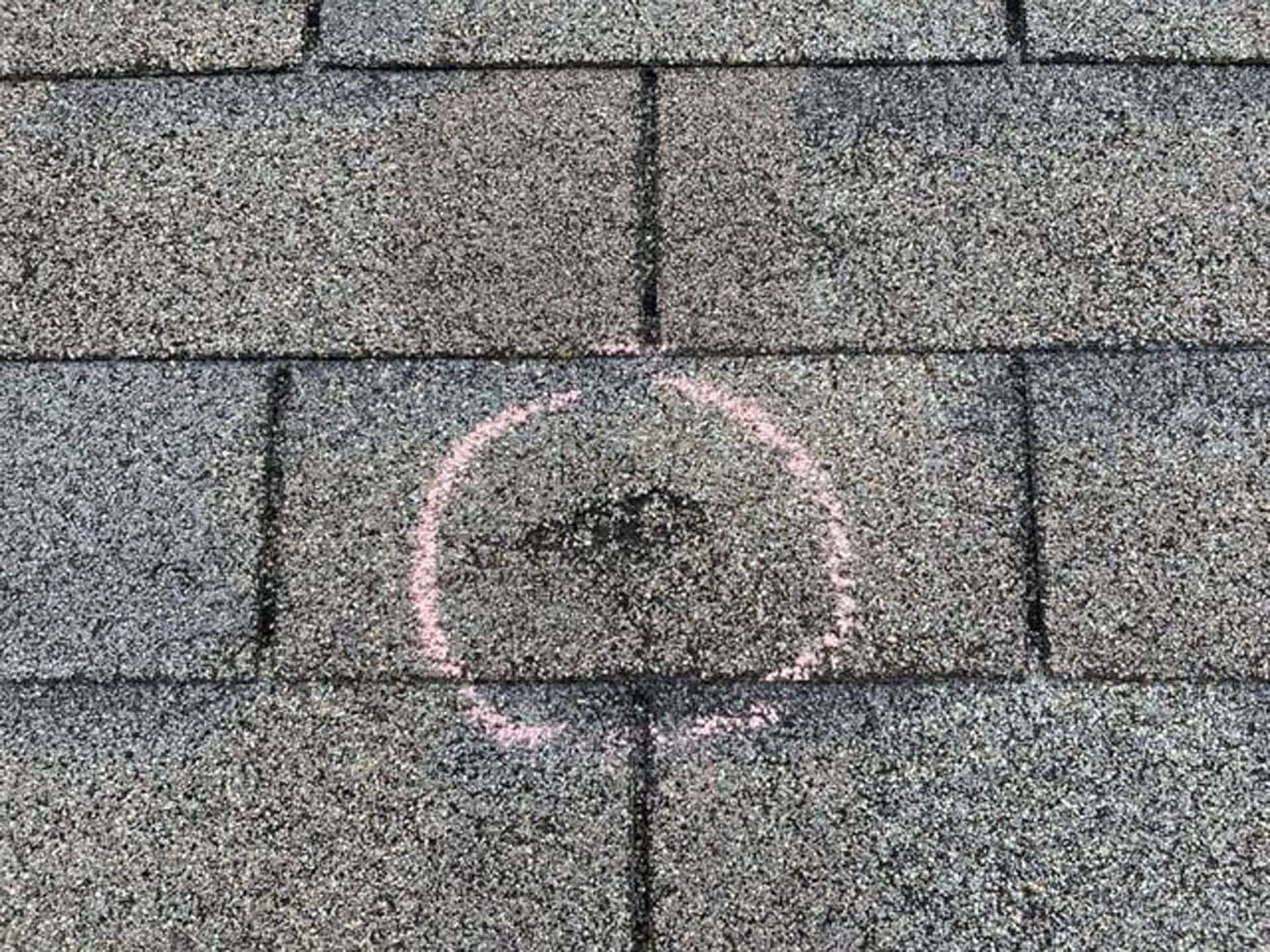 A close up of a roof with a circle drawn on it.