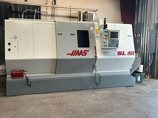 A large machine is sitting in a warehouse.