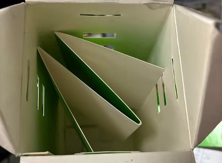 A white box with green triangles inside of it