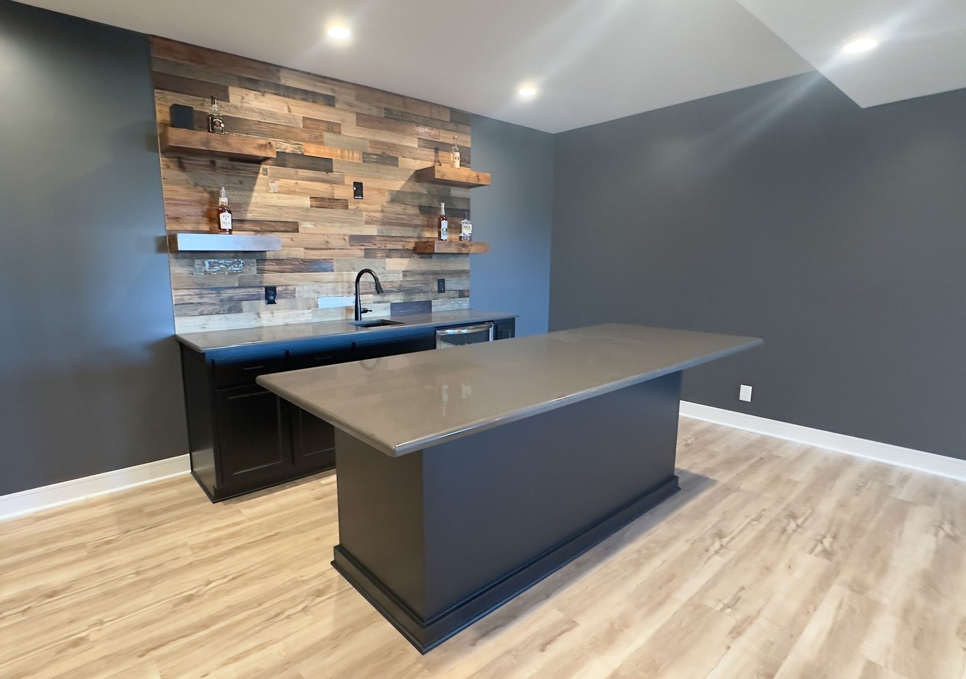 There is a large island in the middle of the room.