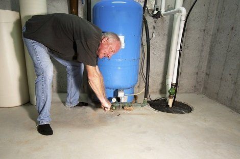 Man Fixing Well Pump — Dunkirk MD — C & C Mechanical Plumbing