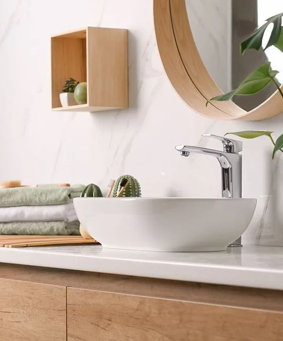 A Bathroom With A Sink, Mirror And Towels On The Counter — Smart Tiles In South Kempsey, NSW