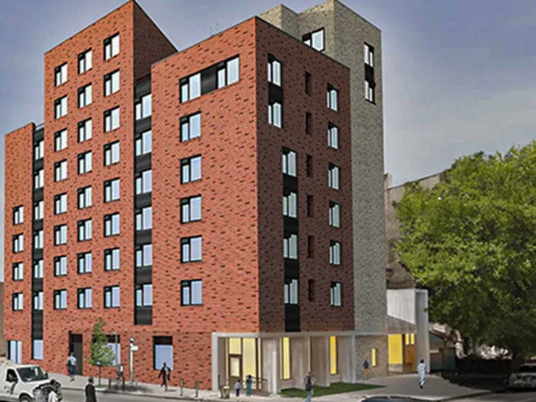 House with a deck under construction; stairs lead to an upper balcony.