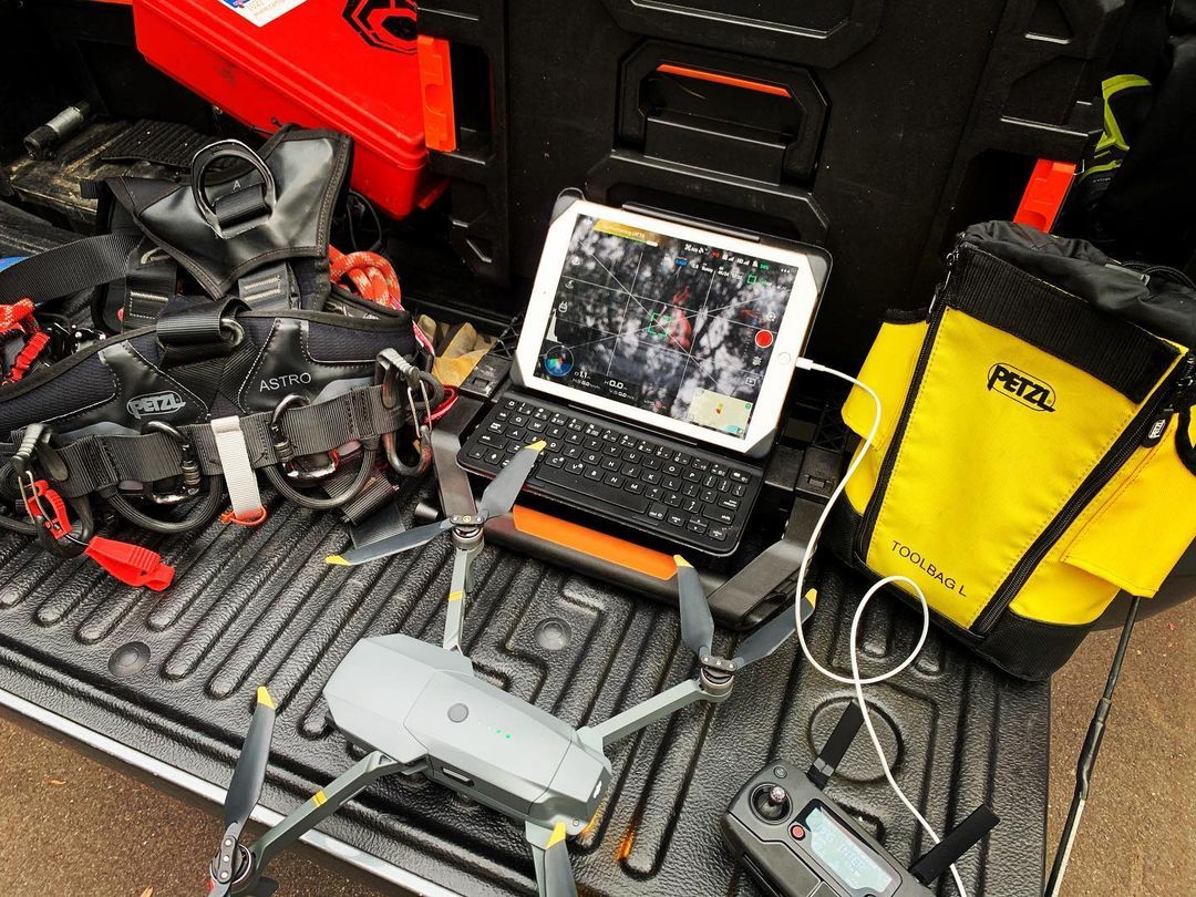 A drone is sitting in the back of a truck.