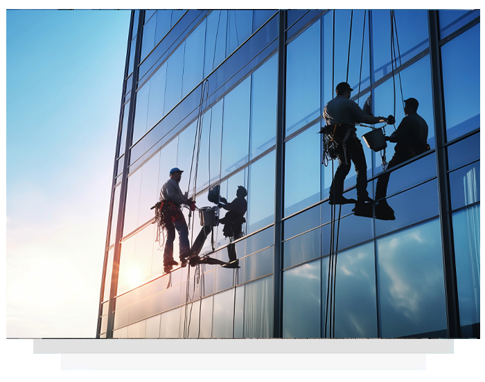 two men cleaning glass surface on a high-rise