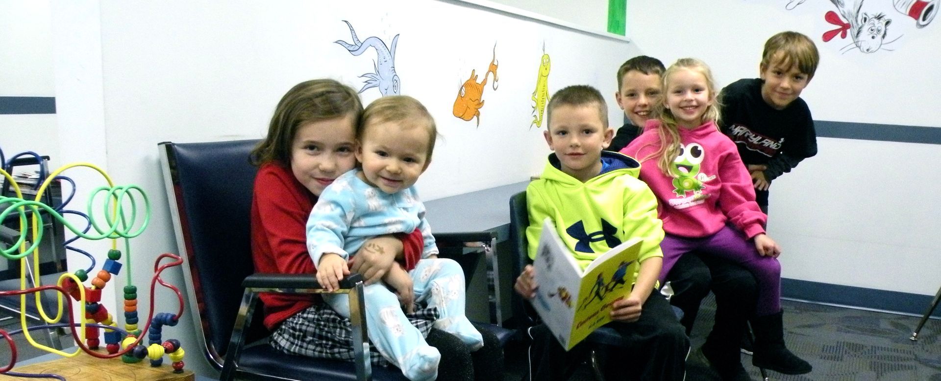 Children sitting in a pediatric waiting room.