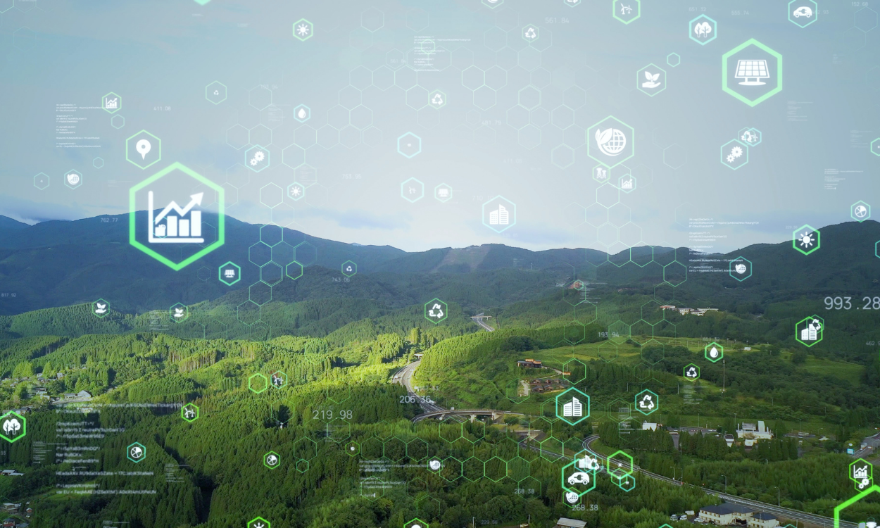 Mountains with green foliage, overlaid with digital data icons.