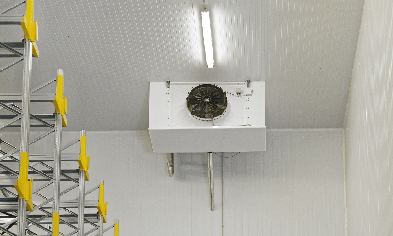 Earth globe made of puzzle pieces, some flying away. Green and blue, on a light blue background.