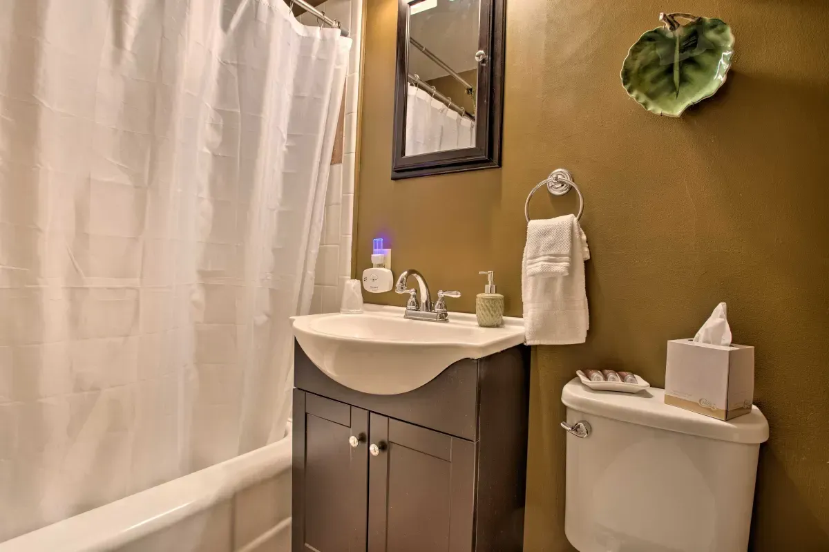 a bathroom with a sink , toilet , and bathtub .