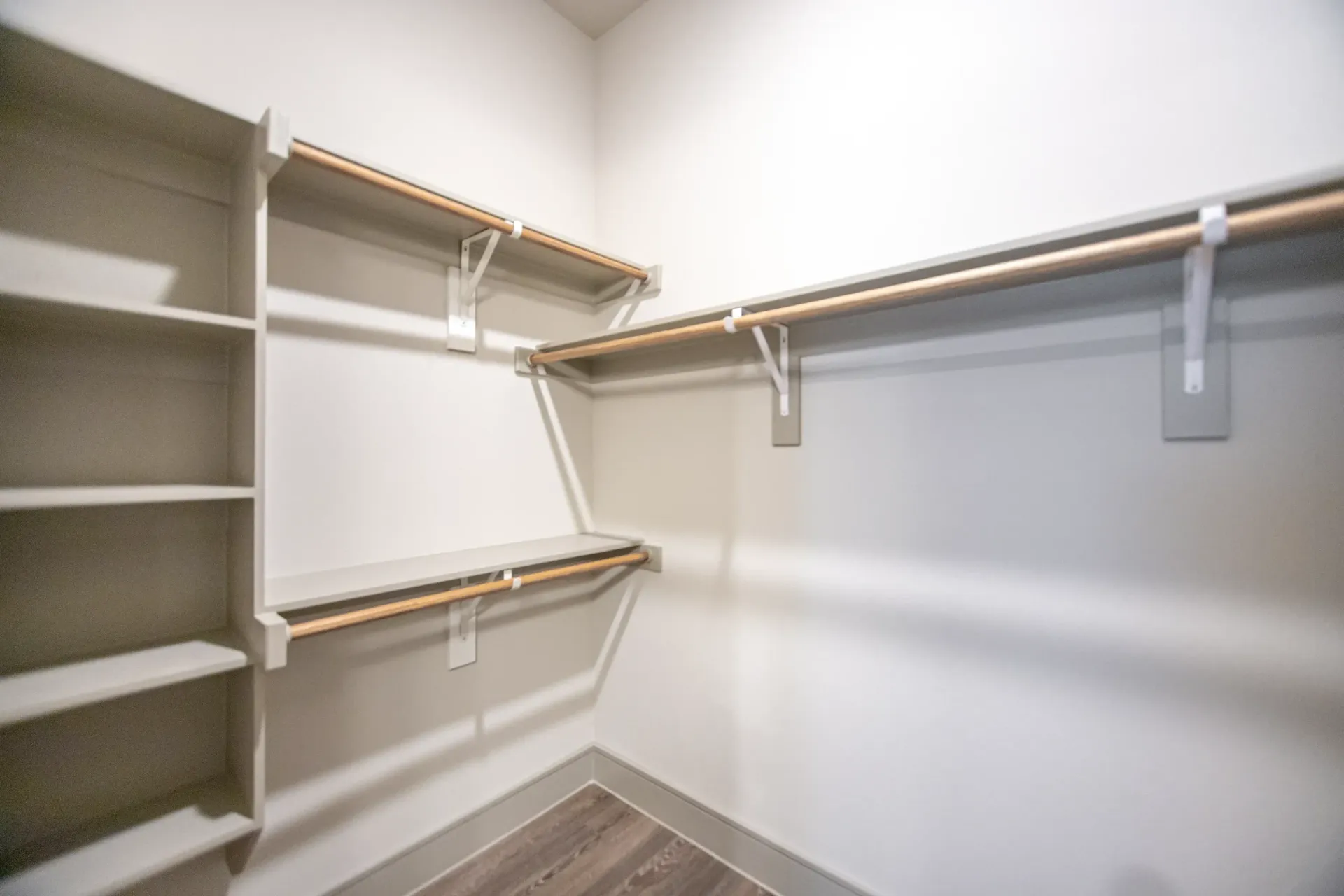 Walk-in closet with built-in shelves and hanging rods
