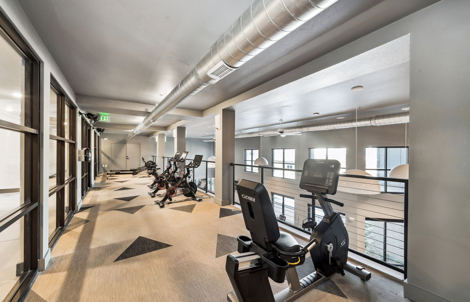 Spacious and well-equipped fitness center at One90 Gateway in Plano, TX.