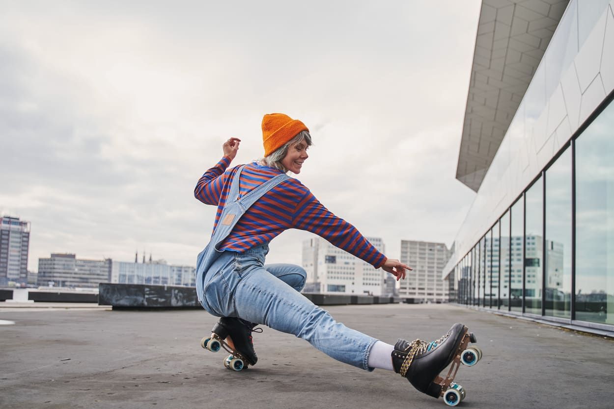 a woman is riding roller skates on a square.
