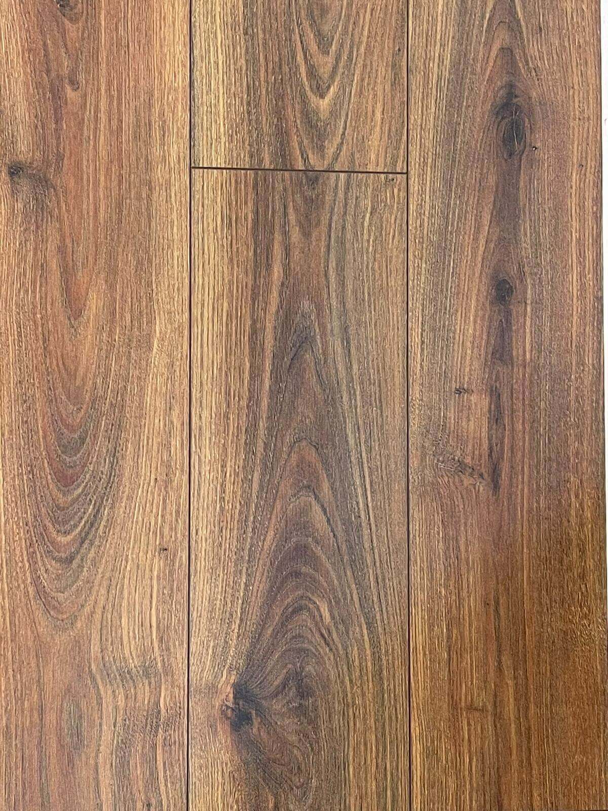 A close up of a wooden floor on a white background.