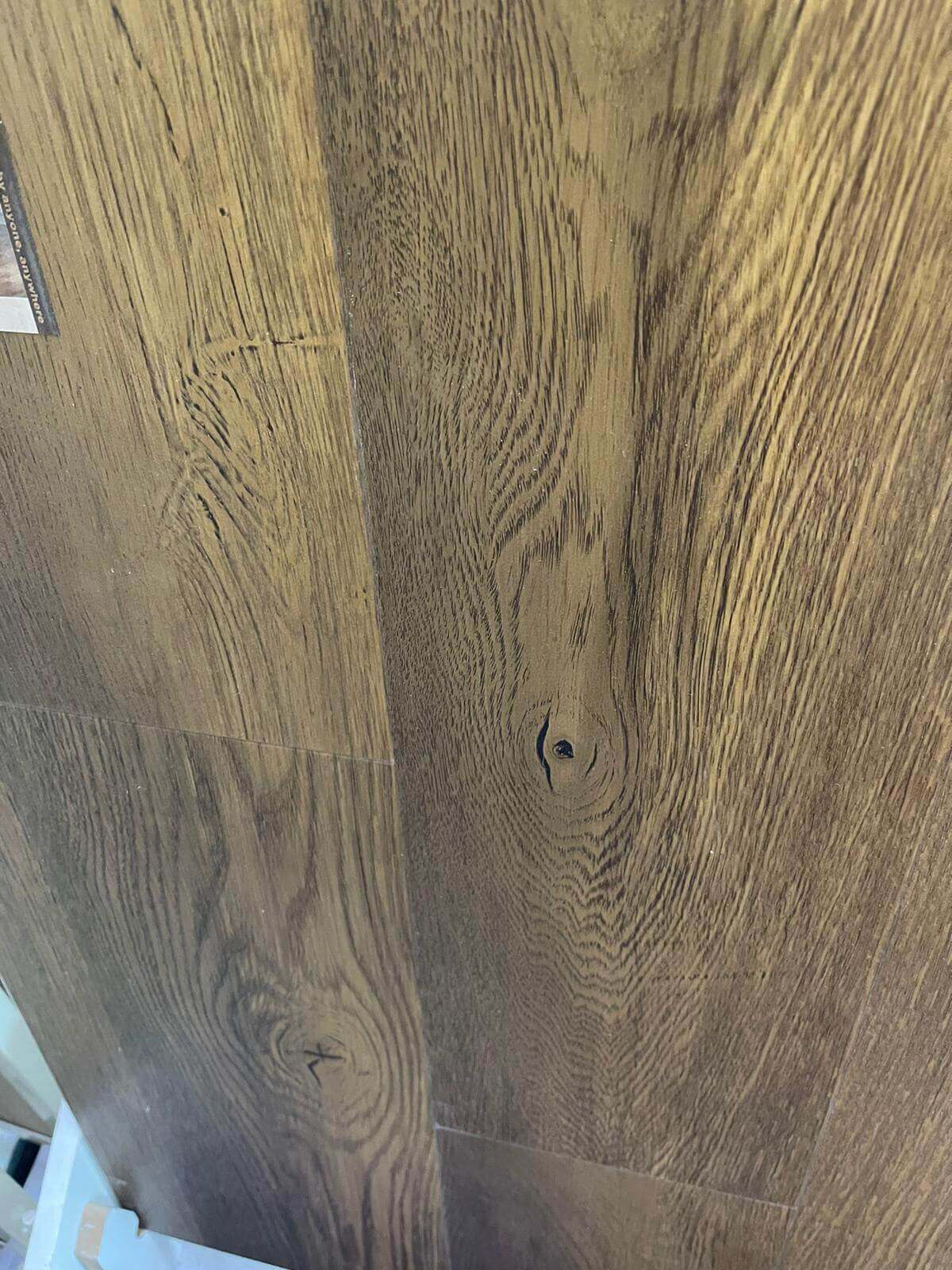 A close up of a wooden floor in a room.
