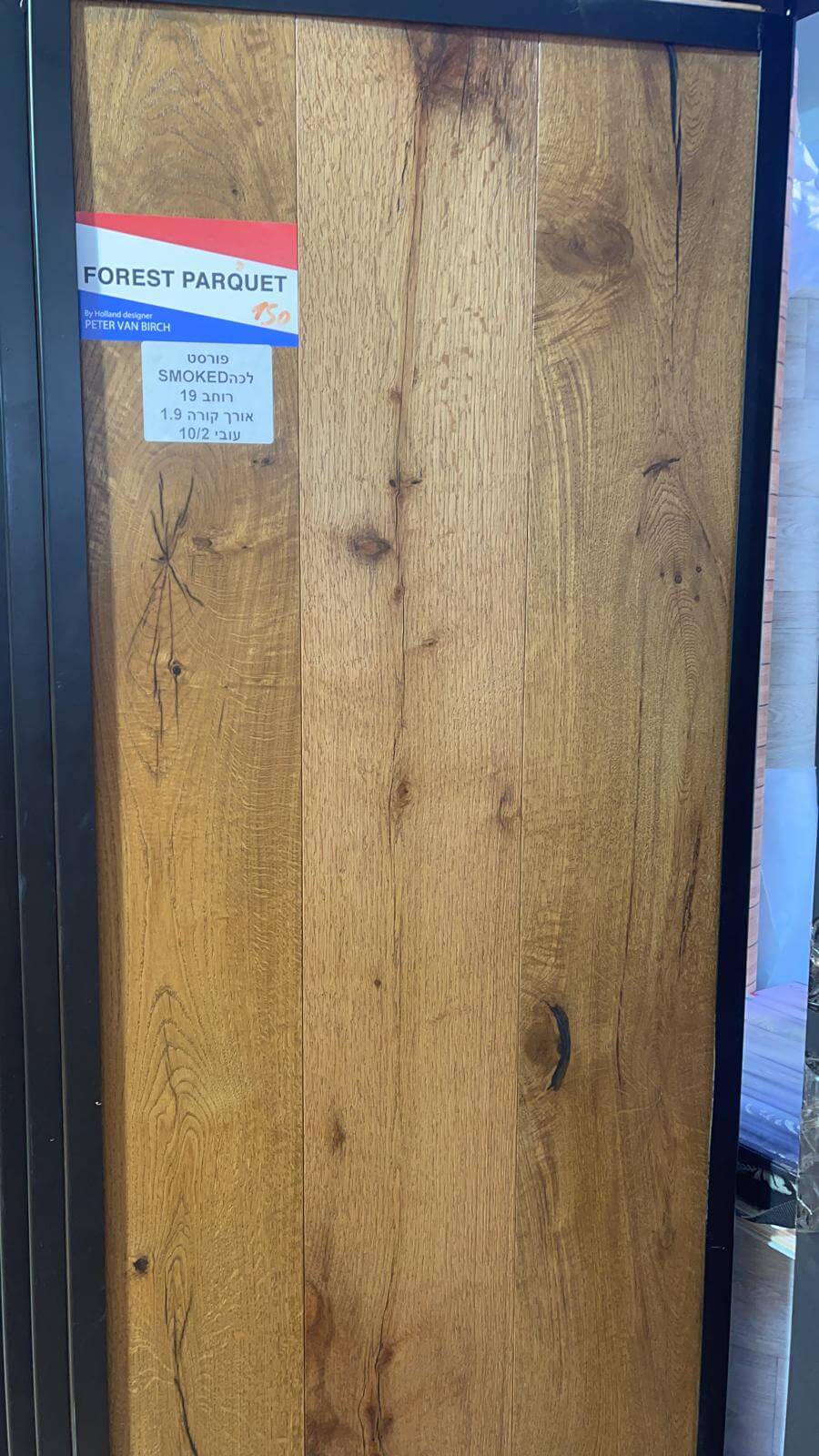 A close up of a piece of wood with a sticker on it.