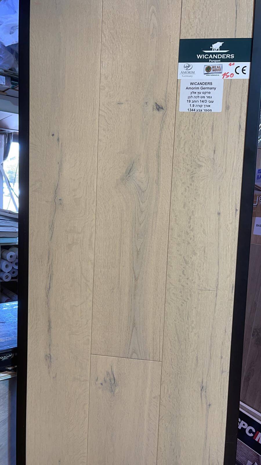 A close up of a piece of wood with a label on it.