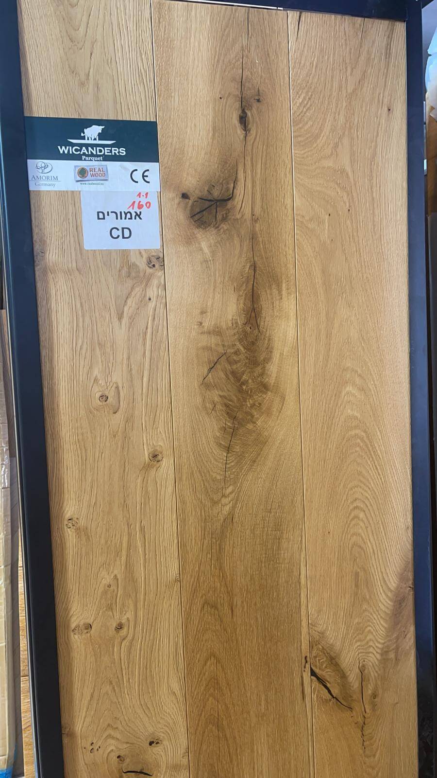 A close up of a piece of wood with a label on it.