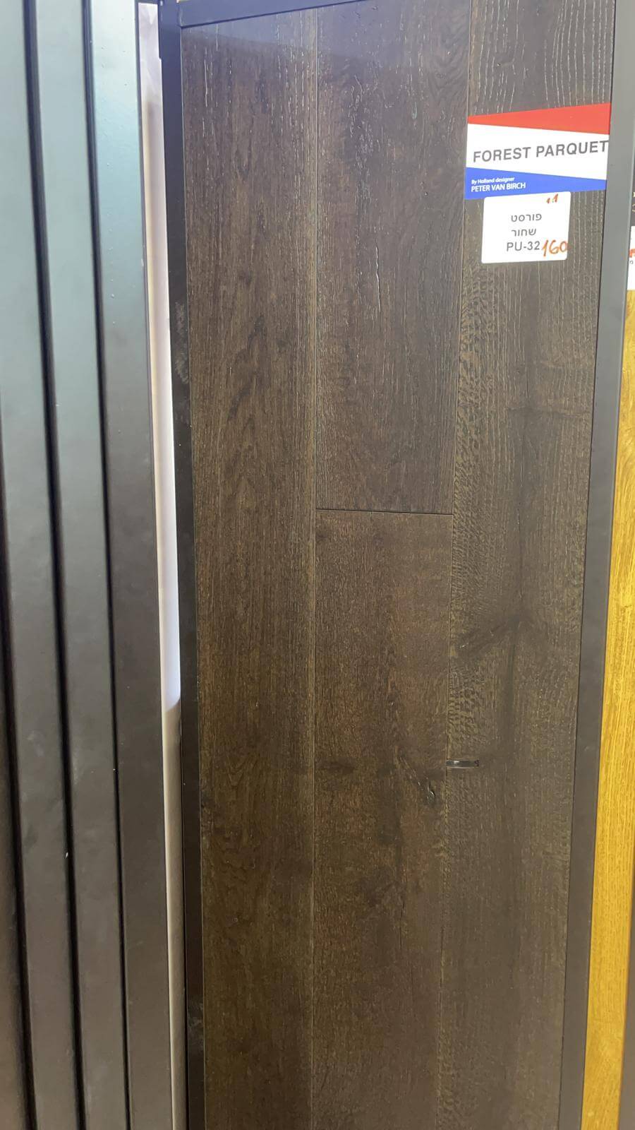 A close up of a piece of wood with a label on it.