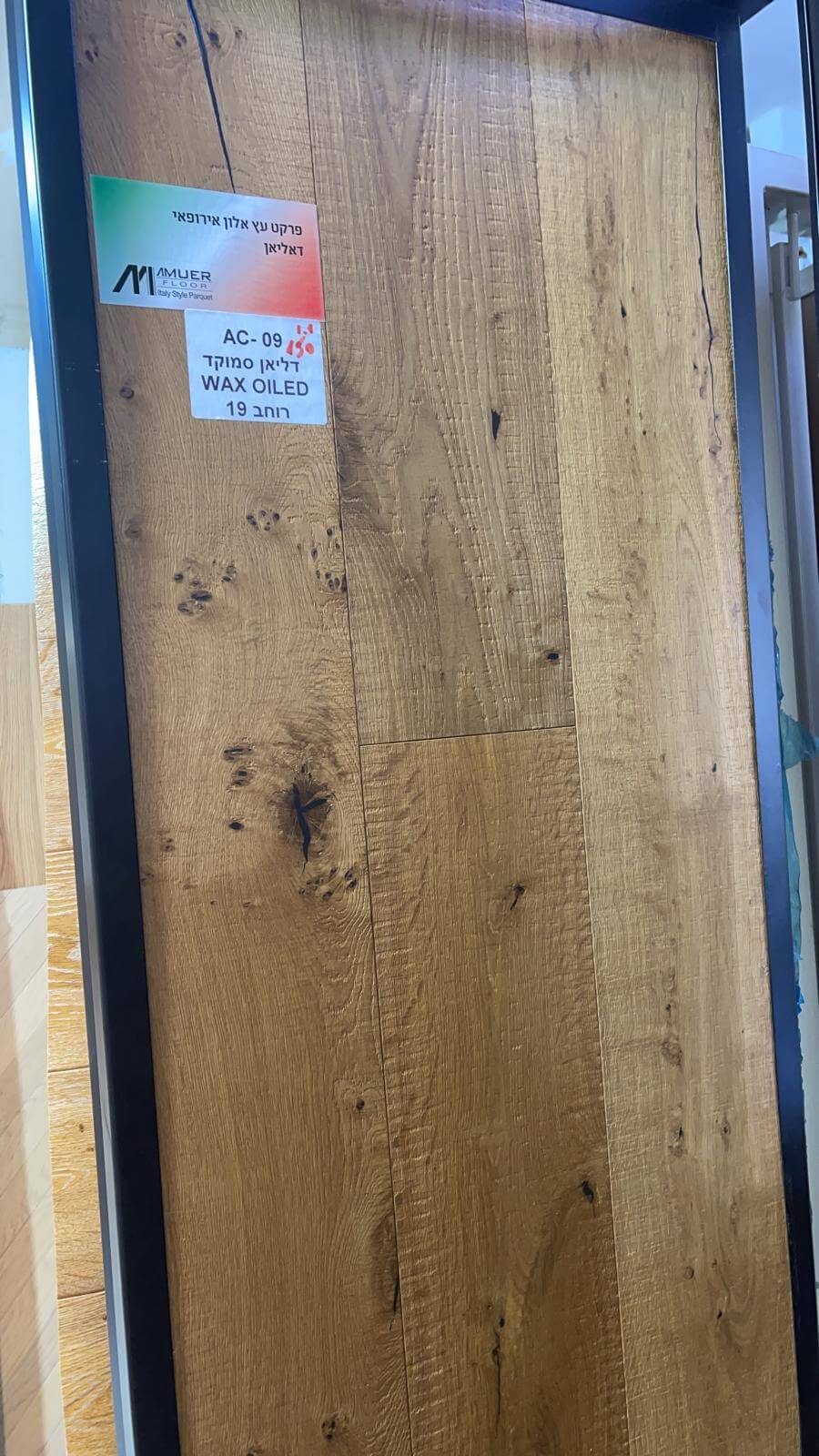 A close up of a piece of wood with a label on it.