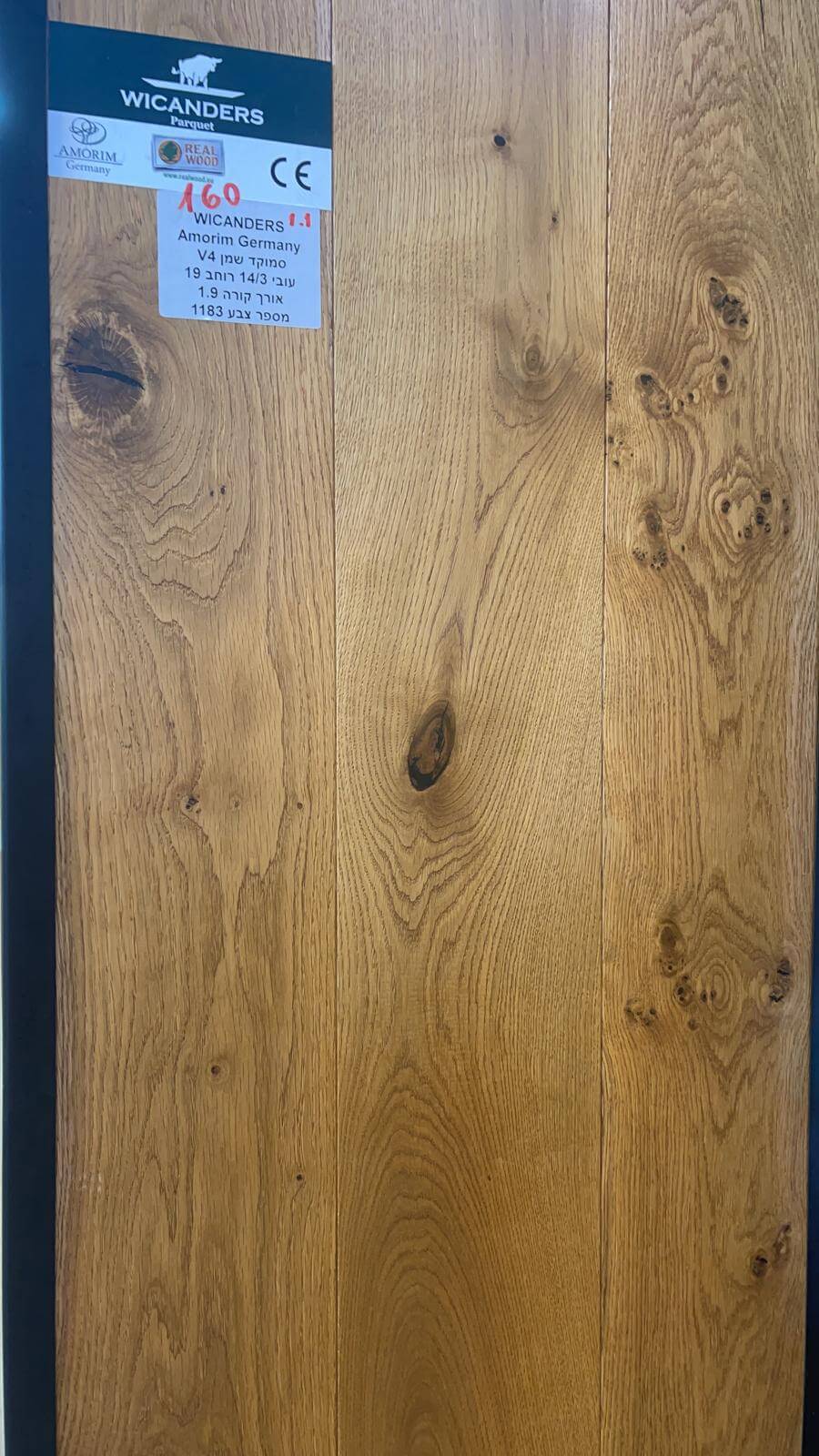 A close up of a piece of wood with a label on it.