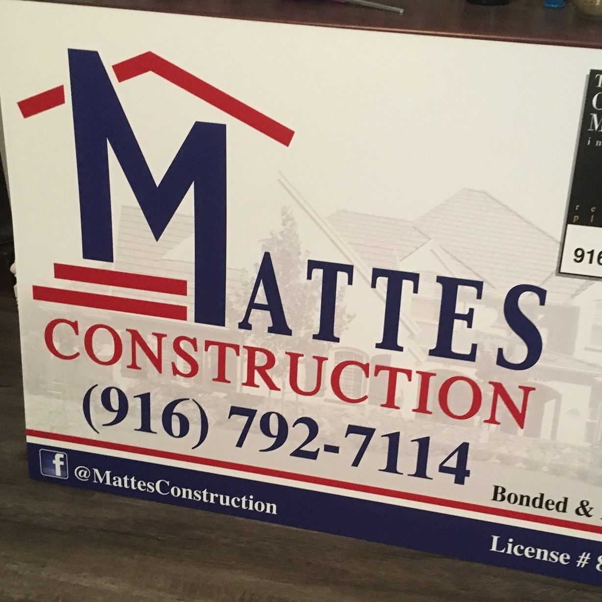 Matte's Construction sign with logo, phone number, and social media handle.