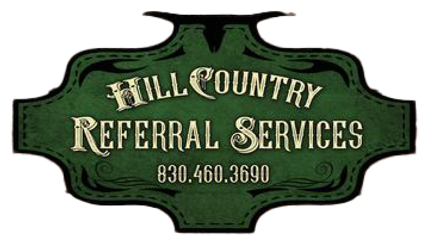 A green sign that says hill country referral services on it.