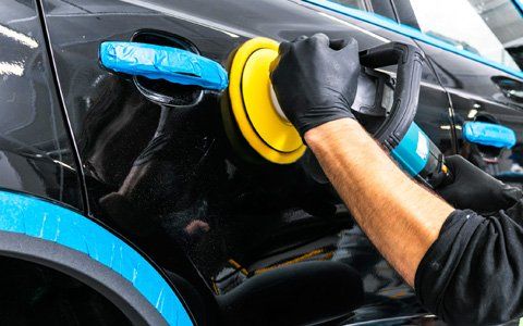 Car Detailing — Worker Applying Car Polish In Greenville, SC