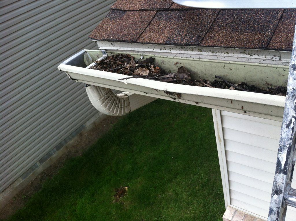 Heavy Buildup Of Debris — Southfield, MI — Henderson’s Gutter Cleaning Service