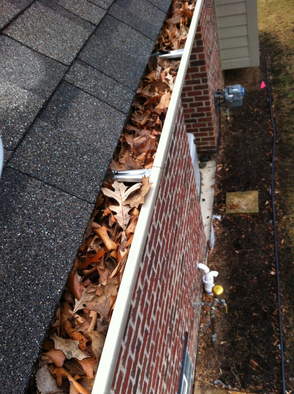 Debris On Gutter — Southfield, MI — Henderson’s Gutter Cleaning Service