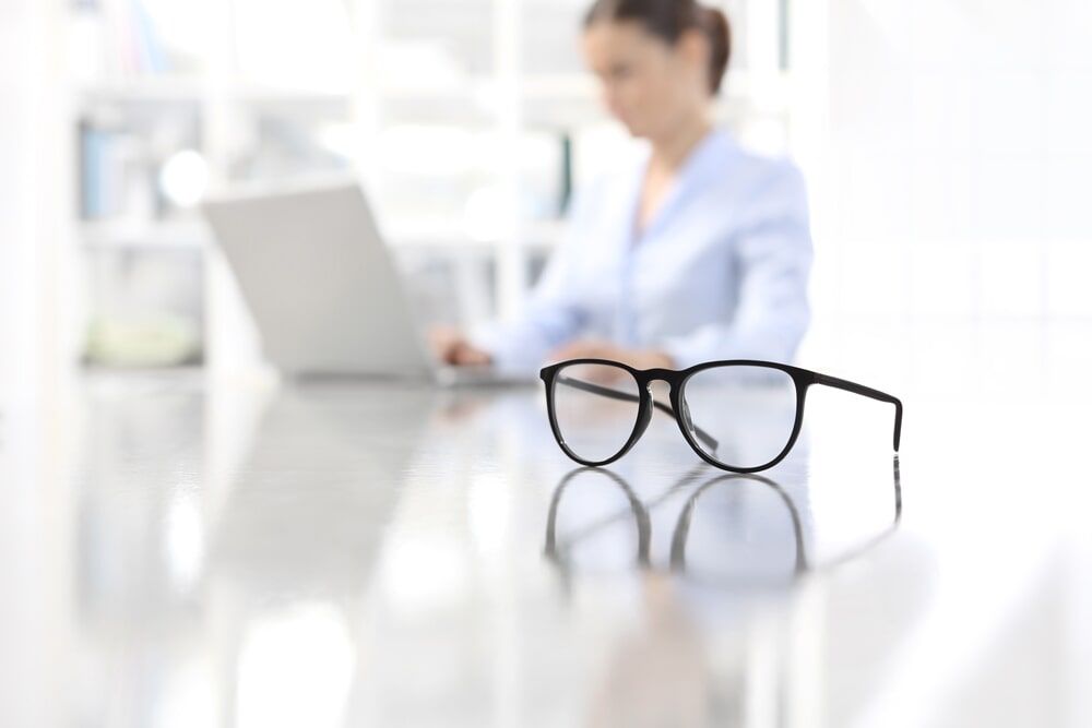 Glasses On Desk - Clear Optometry In Bargara, QLD