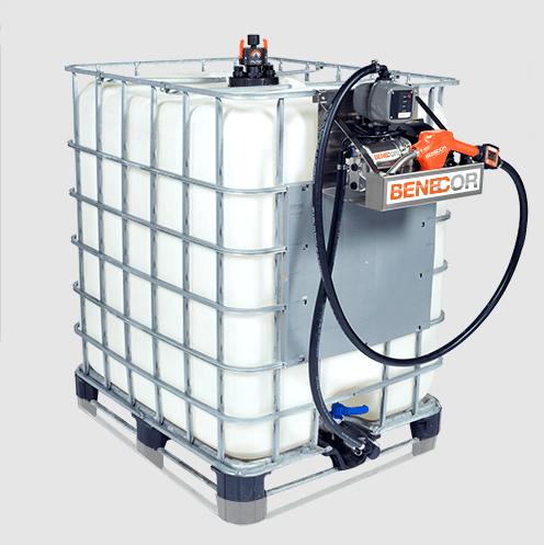 White liquid storage tank with pump attached, inside a metal cage, sitting on a pallet.