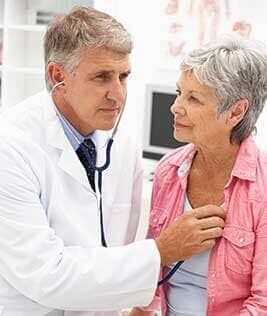 Doctor with Female Patient — Cardiologist in Bedford, IN