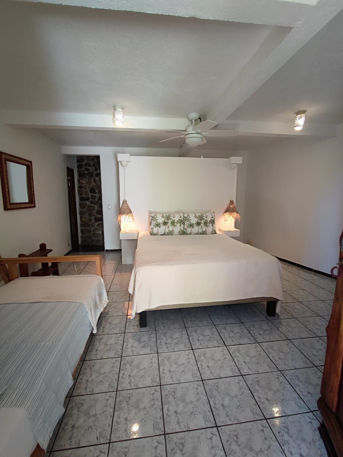There is a large bed in the middle of the room.
