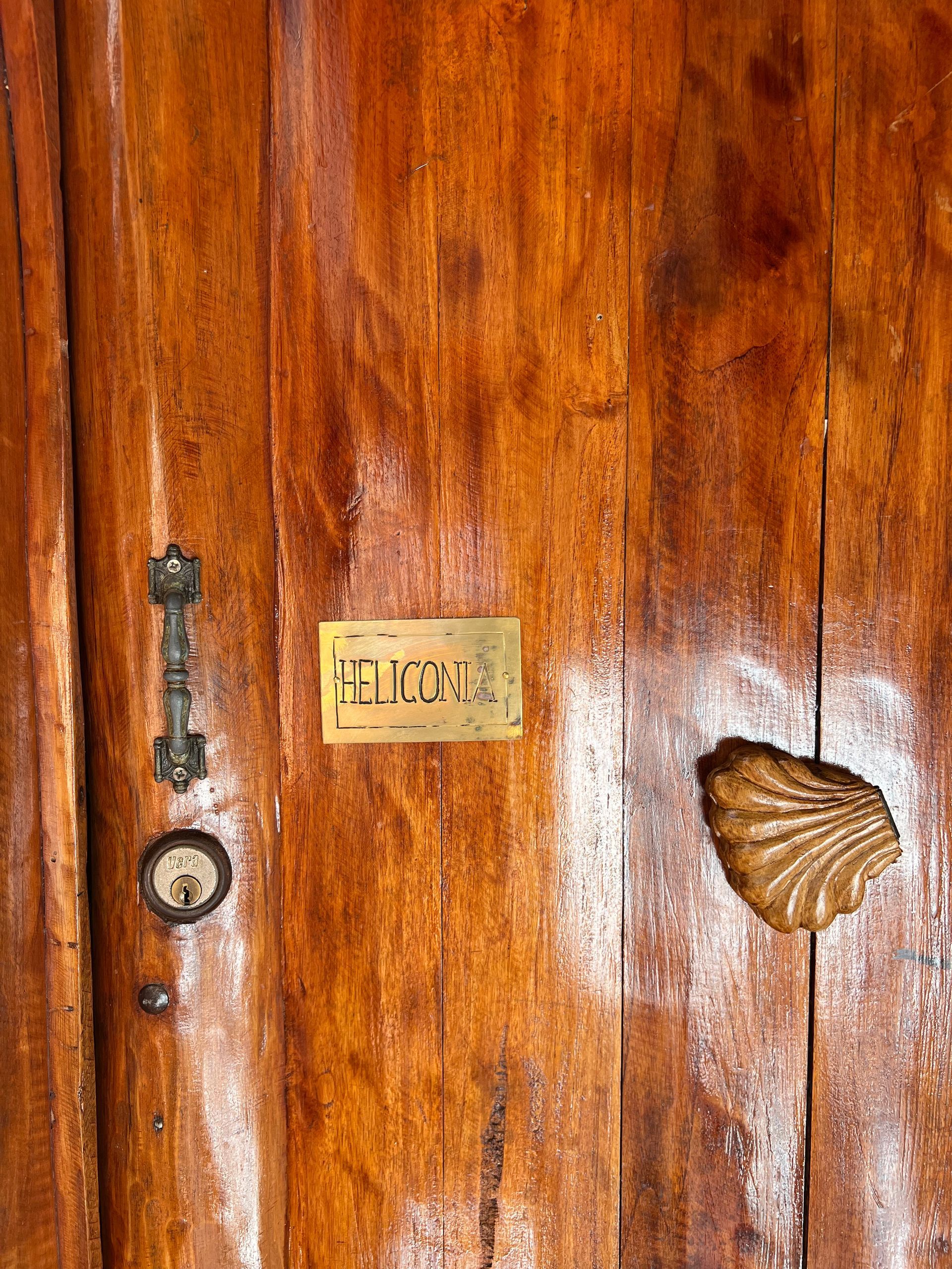 A wooden door with a sign on it that says welcome