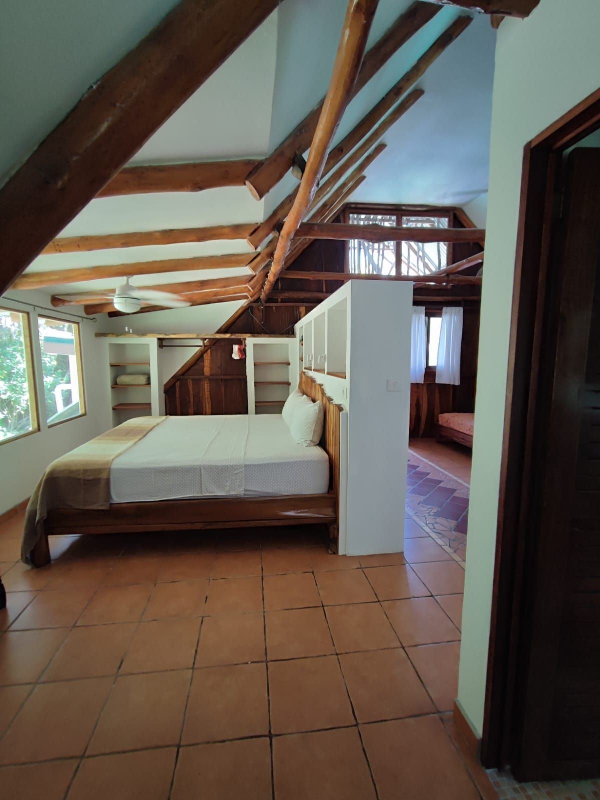 There is a large bed in the middle of the room.